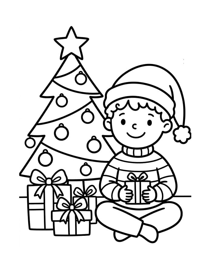 Jongen zittend naast de kerstboom